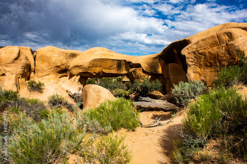 Devils Garden, Hole in the Rock Trail, Grand Staircase National Monument . red sandstone arch with storm clouds