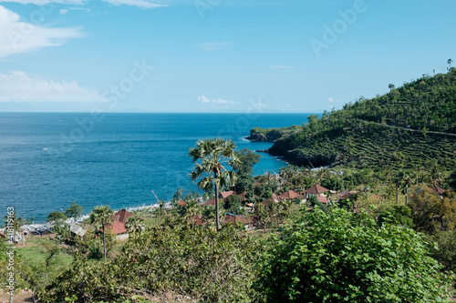 blue sea and houses green hill at Amed, Bali