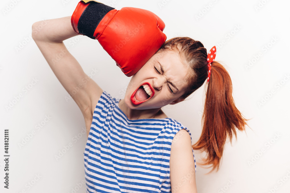 woman in striped t-shirt red boxing glove emotions toning woman in striped t-shirt red boxing glove emotions toning