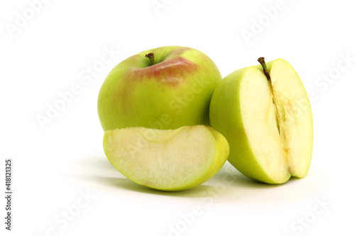 Green apple whole and sliced on white background isolated