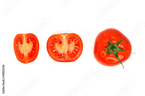 Red tomato whole and sliced on white background isolated