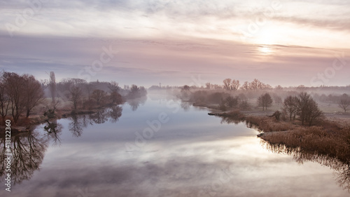A cold morning on the Odra River in Wroclaw, a delicate fog rises above the water. © Castigatio