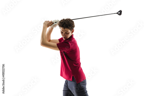 Golf player in a red shirt taking a swing isolated on white studio background with copyspace. Professional player practicing confident, emotions and facial expression. Sport, motion, action concept.