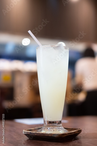 Iced Yuzu orange juice in tall glass.