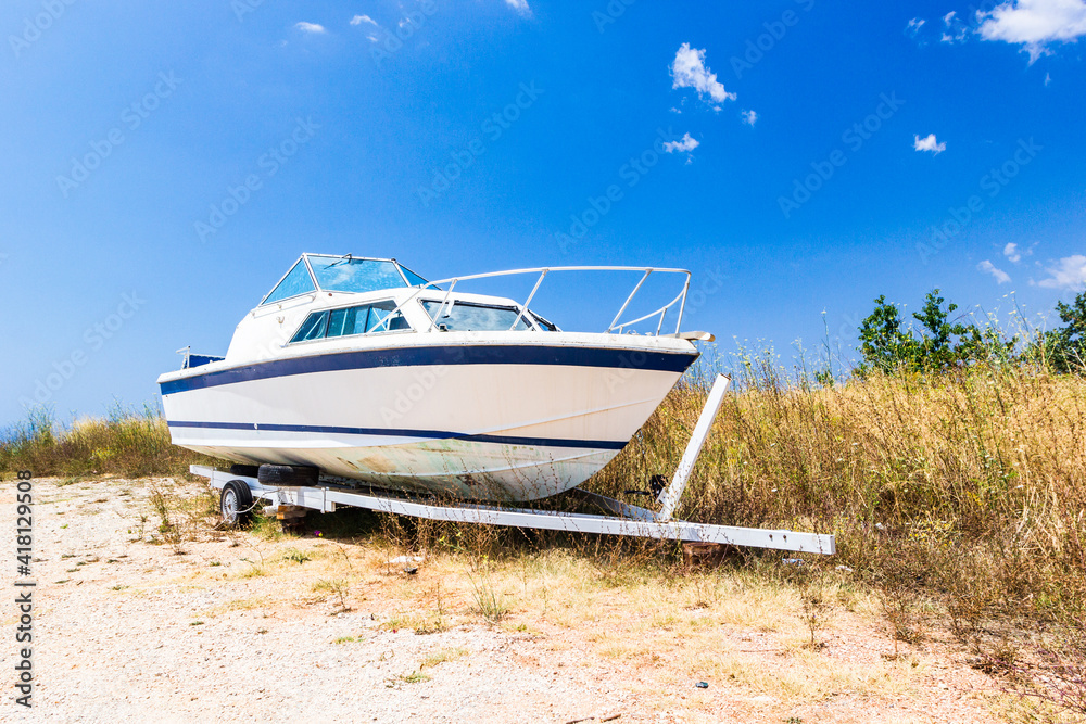 Fototapeta premium Old boat on sandy beach on coastline of Adriatic Sea, Montenegro