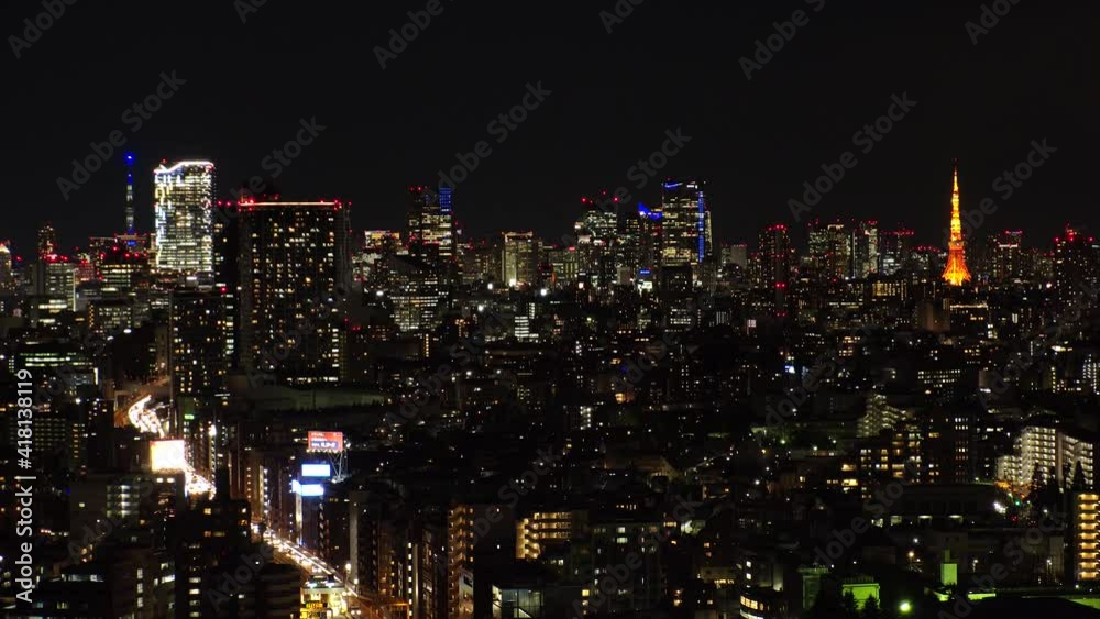 TOKYO, JAPAN : Aerial view of CITYSCAPE of TOKYO at night. View of busy central downtown area (Shibuya and Roppongi). Japanese urban metropolis and nightlife concept. Time lapse zoom in shot. TOKYO, JAPAN : Aerial view of CITYSCAPE of TOKYO at night. View of busy central downtown area (Shibuya and Roppongi). Japanese urban metropolis and nightlife concept. Time lapse zoom in shot.