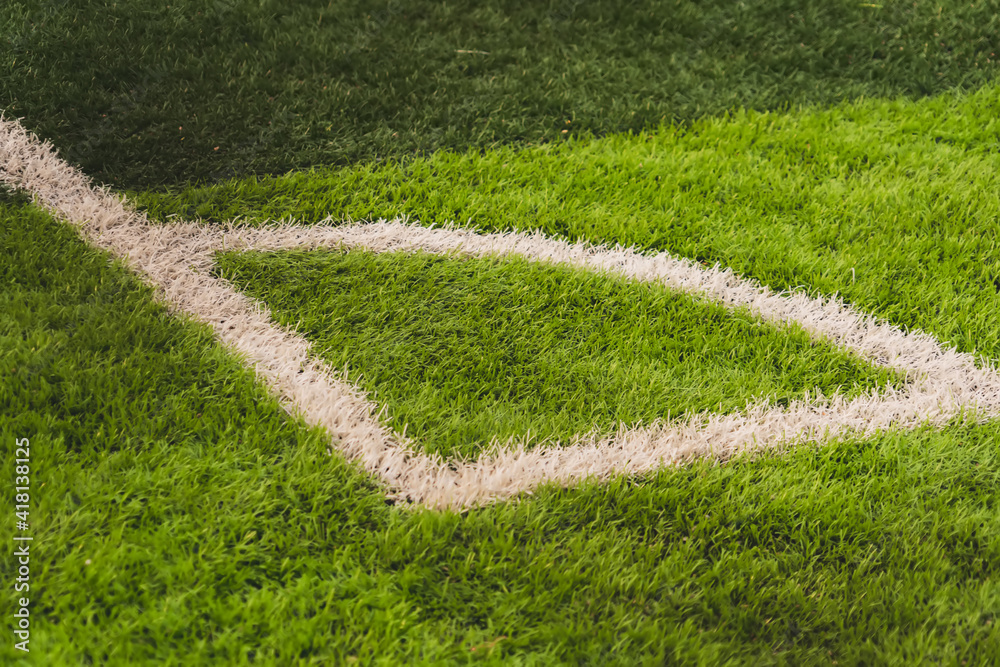 Naklejka premium football corner on green field.