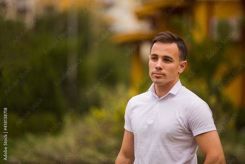Young confident male model posing with crossed hands Young confident male model posing with crossed hands