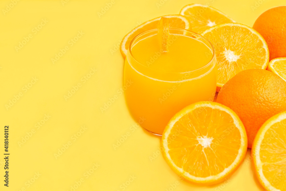 Fresh orange juice in glass with fruits, isolated on yellow. Fresh orange juice in glass with fruits, isolated on yellow.