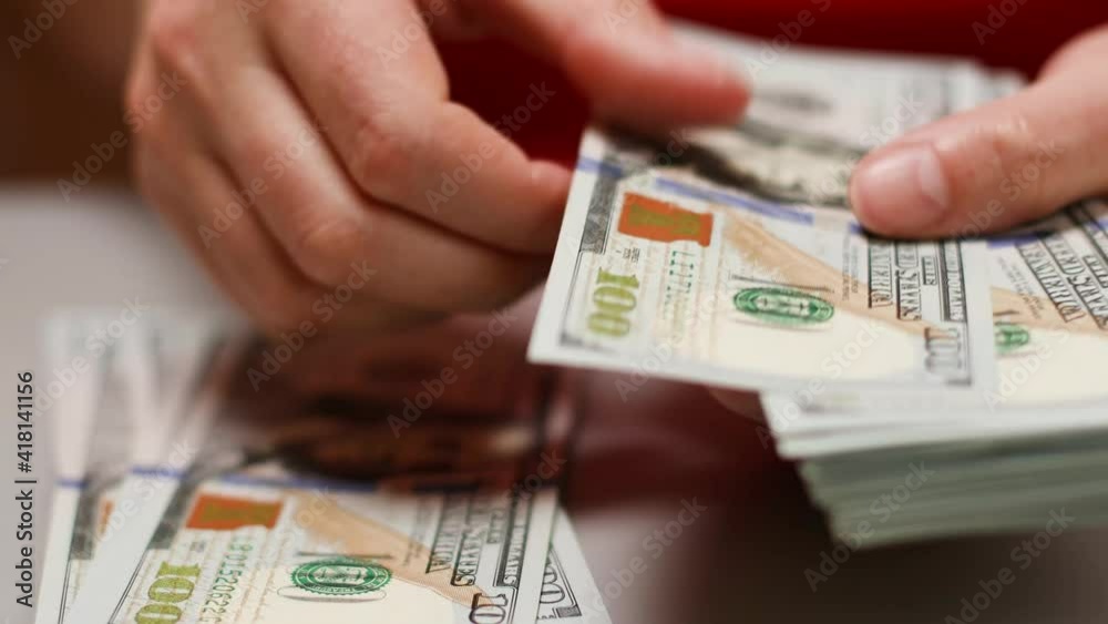 Financial operations with cash money, easy and dirty money. Hands of woman counting money at home. World economic crisis.