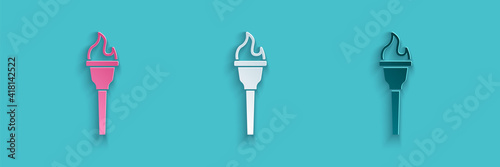 Paper cut Torch flame icon isolated on blue background. Symbol fire hot, flame power, flaming and heat. Paper art style. Vector.