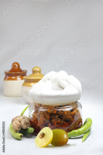 Homemade Indian gooseberry pickle made with chilly,ginger and flavourful spices which makes pickle healthy veg. side dish. photo