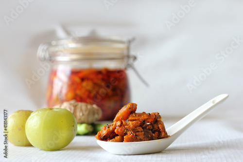 Fotografie Homemade Indian gooseberry pickle made with chilly,ginger and flavourful spices which makes pickle healthy veg