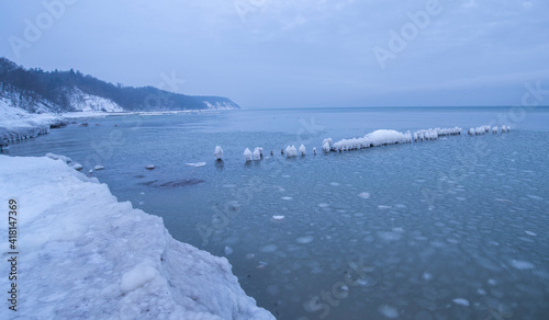 Ice breakwaters in winter. sea winter blue landscape.