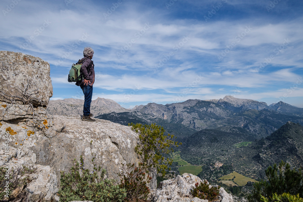 Fototapeta premium Alaro castle, man on ruins of the western walls, Alaro, Mallorca, Balearic Islands, Spain