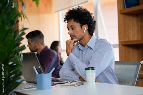 black business man watching meeting on laptopin the office. . photo