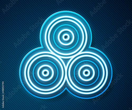 Glowing neon line Paint spray can icon isolated on blue background. Vector.
