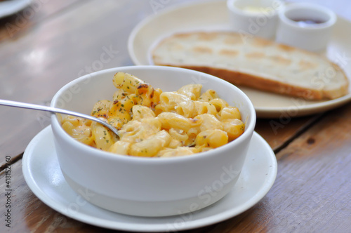 cheese macaroni, macaroni with cheese topping or eating macaroni and toast