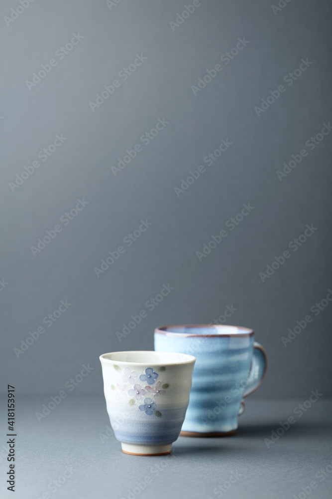 Traditional, handcrafted ceramic on gray background. Soft focus. Copy space.