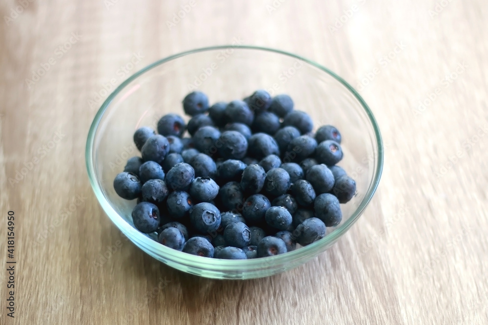 Bowl of blueberries on the table. Selective focus. Bowl of blueberries on the table. Selective focus.