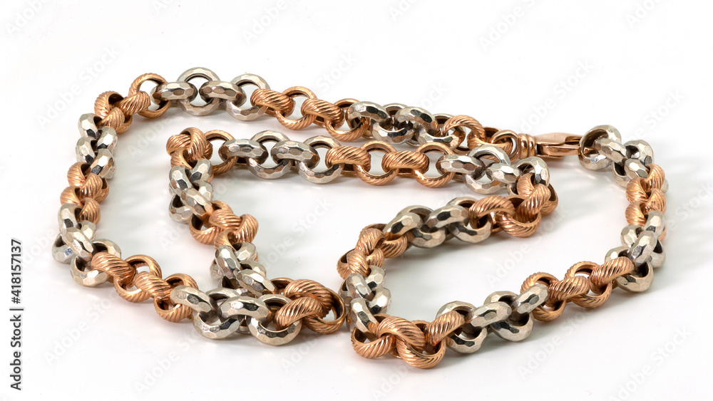 Obraz premium Golden braided chain on a white background