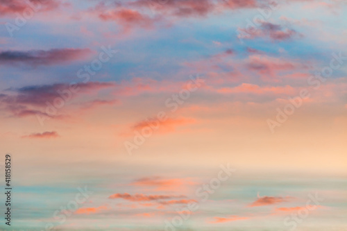 fantastic colorful sky at sunrise with small split clouds © Coka
