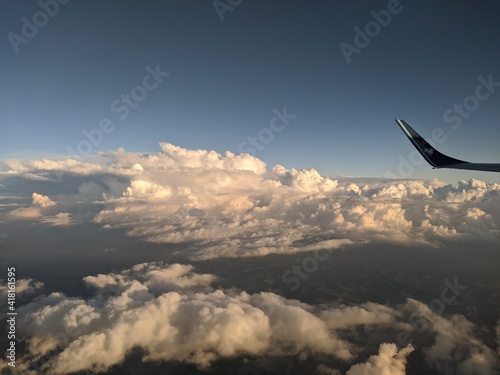 airplane flying over the clouds © Filipe