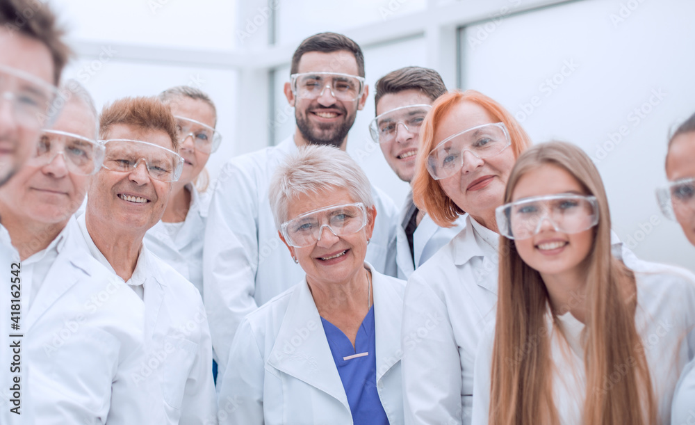 large group of medical researchers standing together large group of medical researchers standing together
