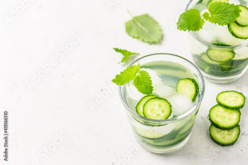 Infused cucumber iced water. Space for text, top view.