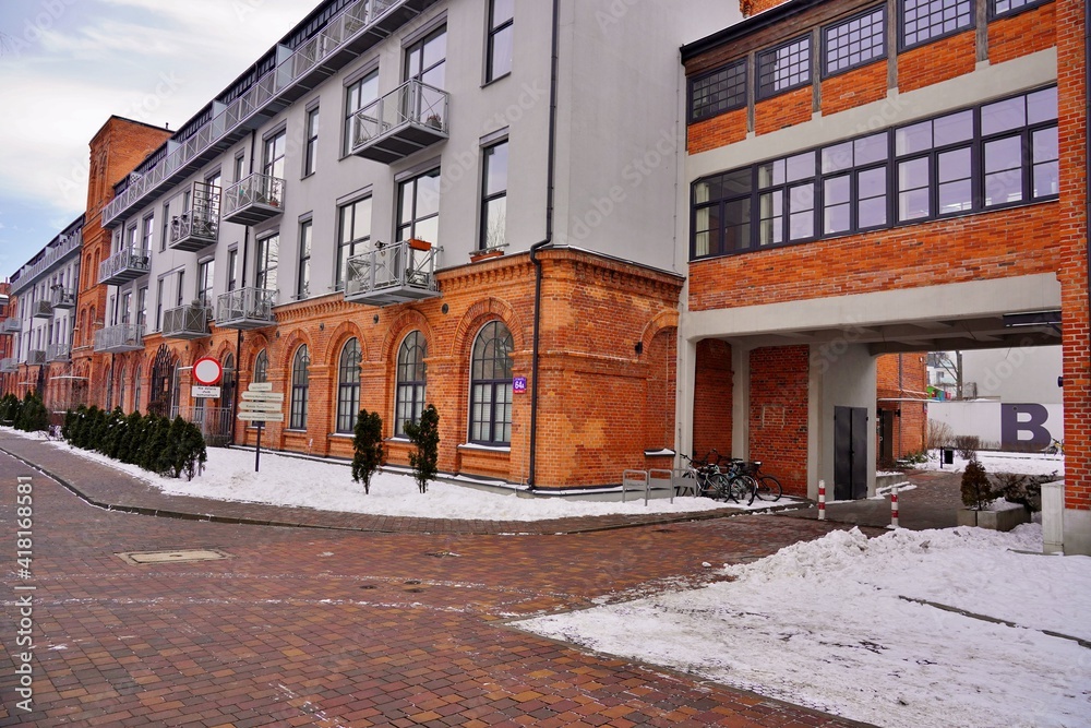 Architecture in Lodz. Housing estate and hotel . Mix of old and modern architecture. Winter day 