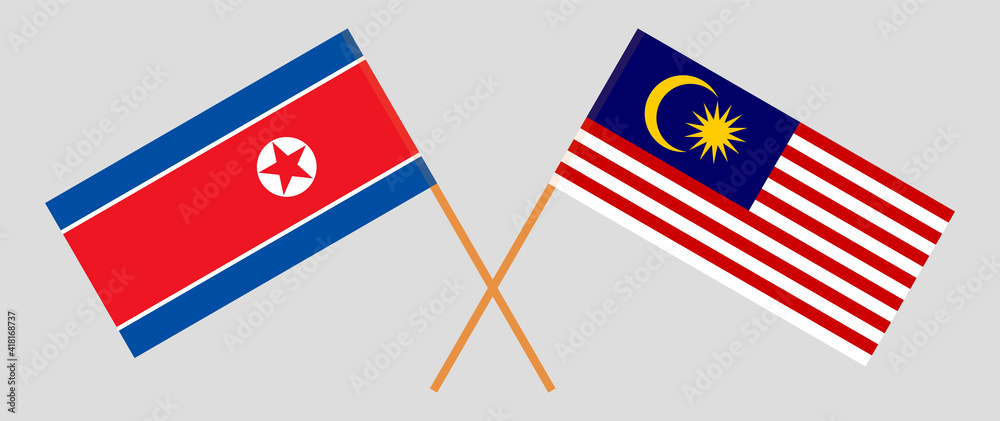 Crossed flags of North Korea and Malaysia. Official colors. Correct proportion Crossed flags of North Korea and Malaysia. Official colors. Correct proportion