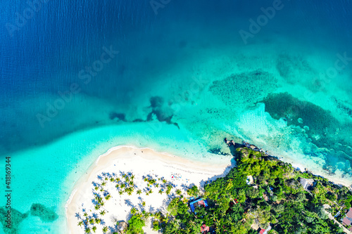 Vacation background. Aerial drone view of beautiful caribbean tropical island Cayo Levantado beach with palms. Bacardi Island, Dominican Republic.