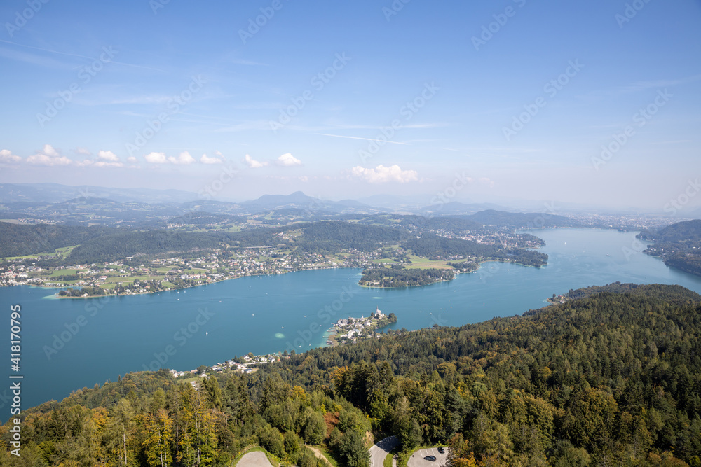 Panoramic top view of the green Austrian Alps, Maria Wörth and Werthersee lake