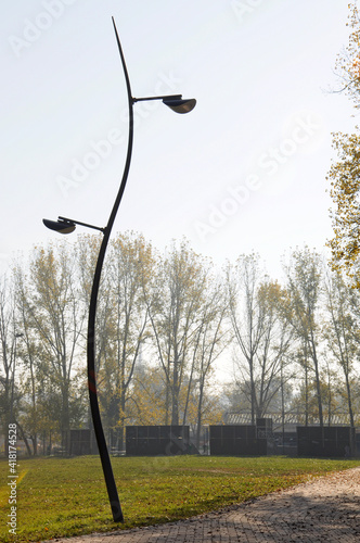 Elegant modern street lamp light silhouette in Limanski park,Novi sad,Serbia. photo