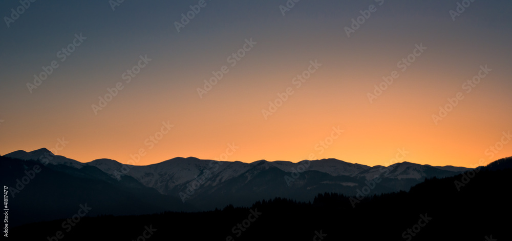 Sunset colors above mountains