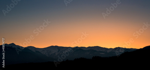 Sunset colors above mountains