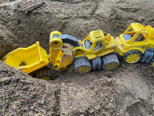 toy trucks in the sand