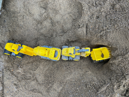 toy trucks in the sand
