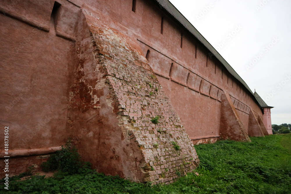 close up view of red brick medieval wall of Saviour Monastery of St. Euthymius in Suzdal, Russia