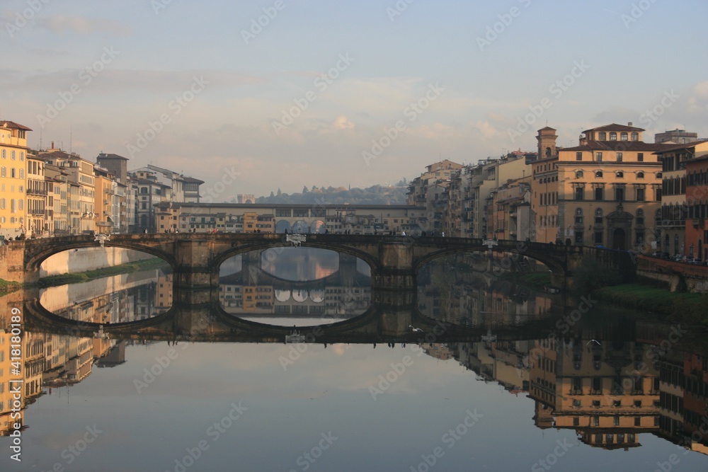 Fototapeta premium Florence, Italy. Bridges and buildings reflecting in Arno river