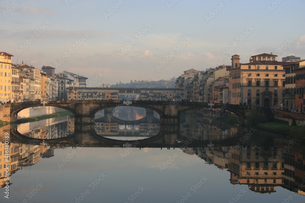 Florence, Italy. Bridges and buildings reflecting in Arno river