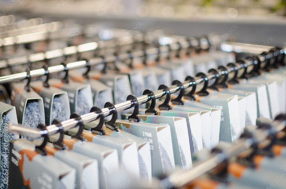 Obraz premium Sports socks in packaging on a display case.
