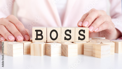 woman made word Boss with wooden blocks