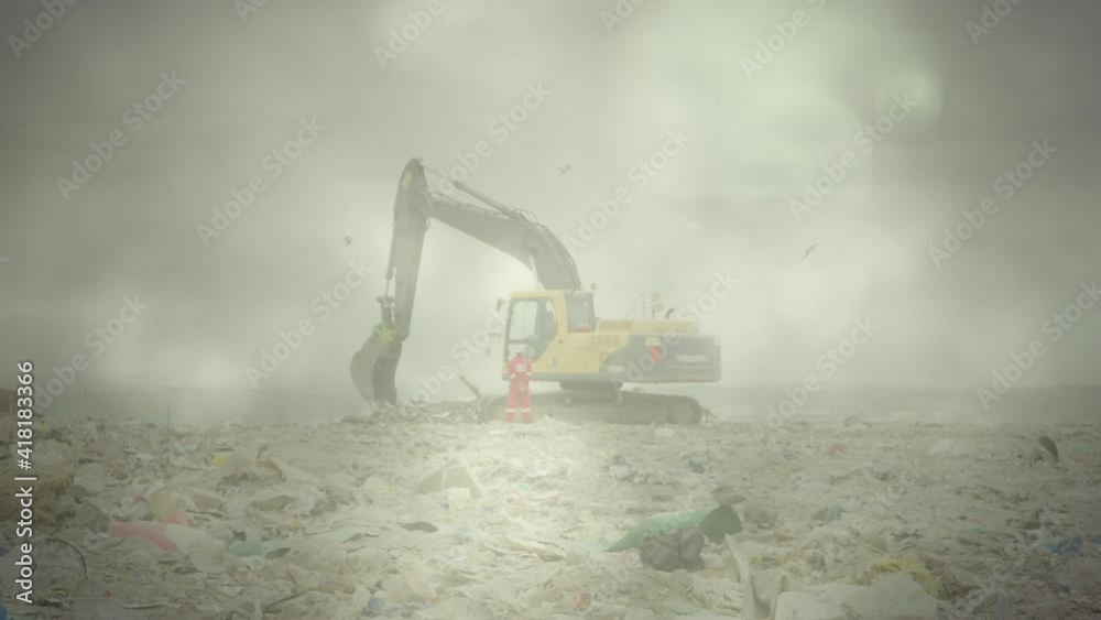 Green glowing lights over digger in rubbish disposal site