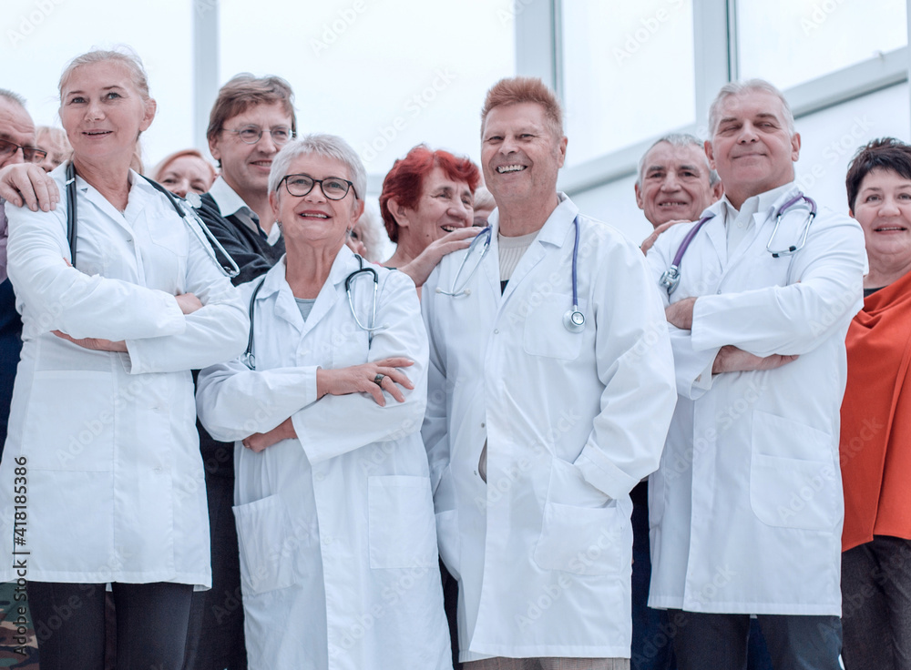 a group of senior citizens and doctors in full growth put a hand a group of senior citizens and doctors in full growth put a hand