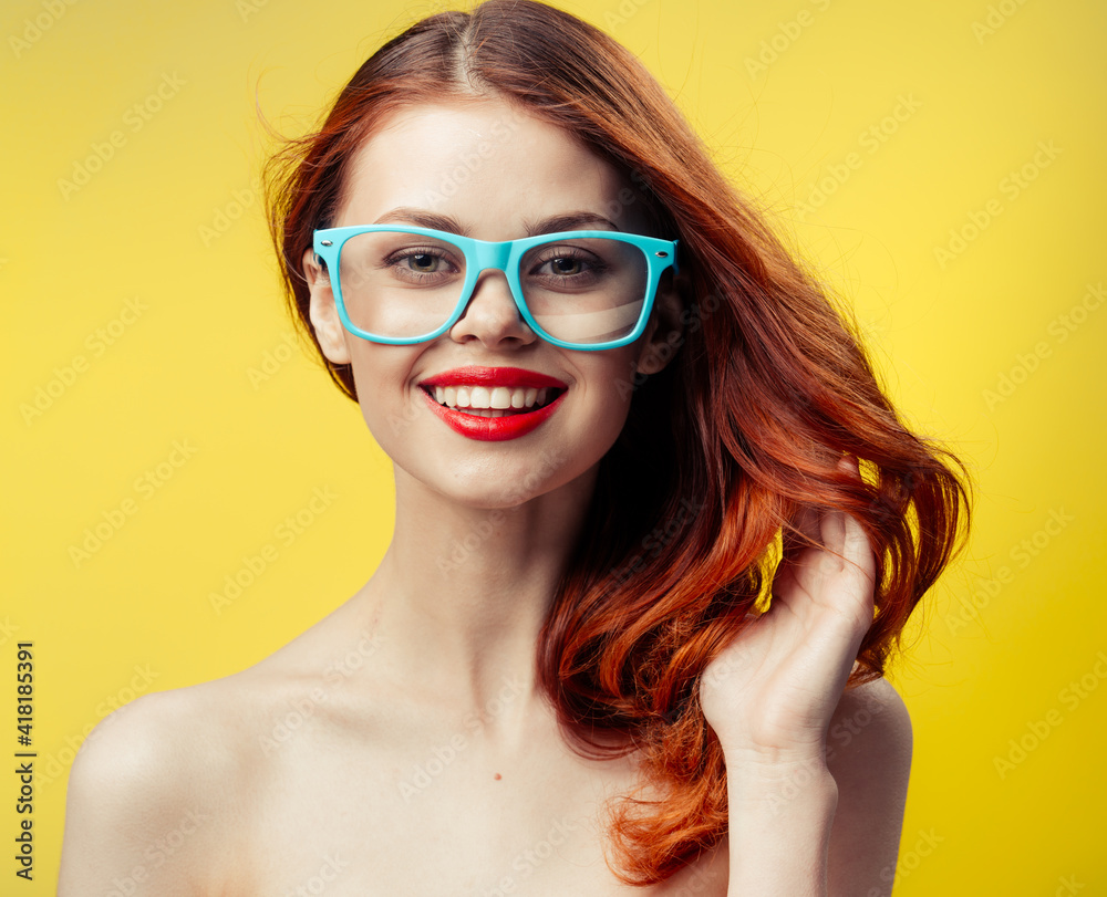 attractive woman with bare shoulders blue glasses red hair cropped view attractive woman with bare shoulders blue glasses red hair cropped view