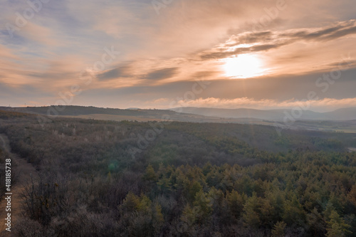 Beautiful sunset overt the forest from drone view