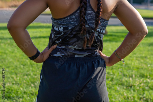 unrecognizable young woman with her back turned ready to exercise