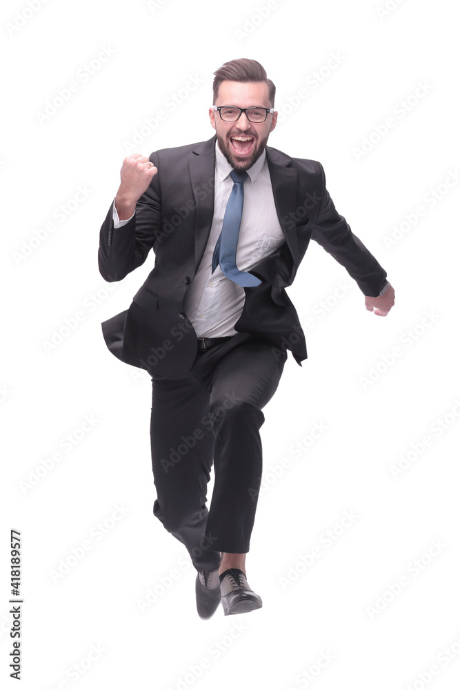 in full growth. happy dancing young businessman in full growth. happy dancing young businessman