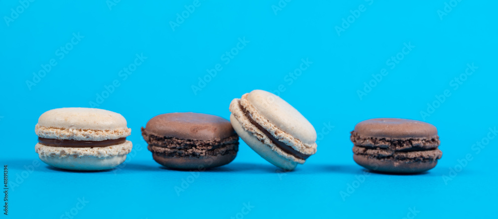 macarons on blue and yellow background macarons on blue and yellow background